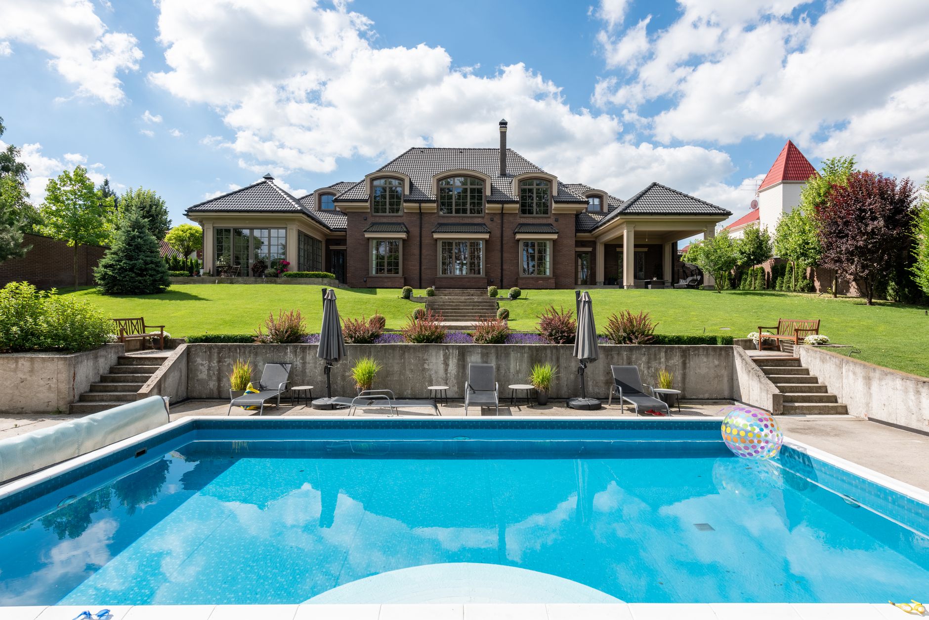 Luxury estate with inground pool and manicured grounds
